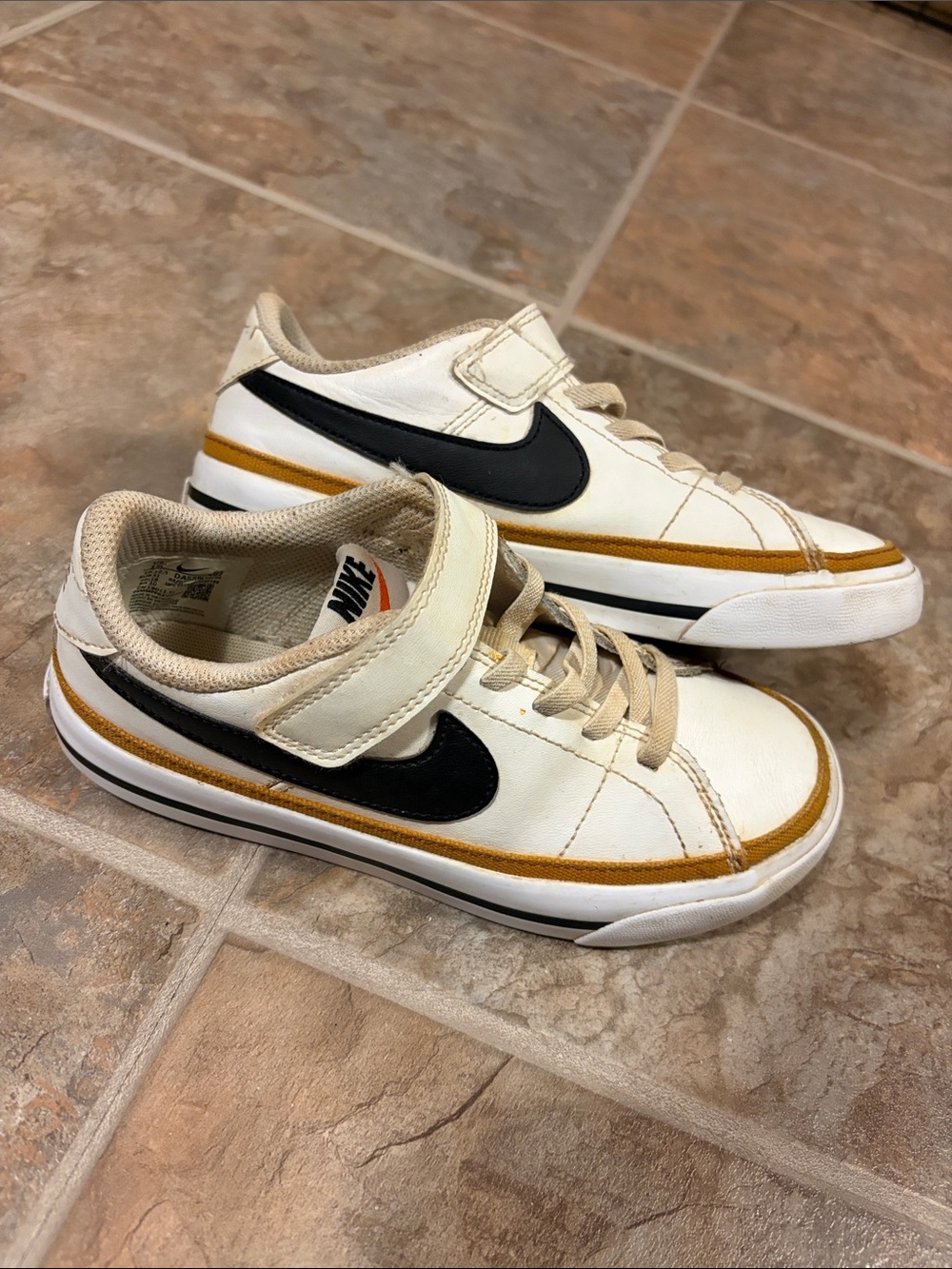 Nike Kids White Sneakers with Black Swoosh and Gold Accent 13c